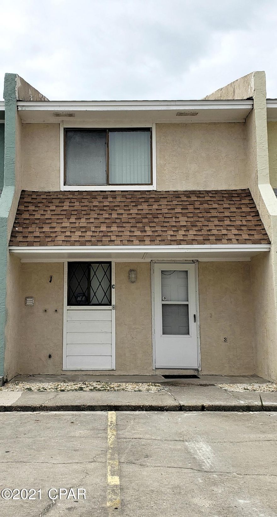 CURRENTLY UNDER CONTRACT, SELLER ACCEPTING BACKUP OFFERS. East end of the beach, south of Thomas Drive, NO HOA fees! This two-story town home is in a six-unit complex. Interior and exterior design features two large bedrooms, bath and a half, kitchen/living room combination, balcony overlooking private back yard, and open patio. It's steps away from the white sandy beach, short distance to St Andrews State Park, Navy/Coast Guard base, public boat ramp, and more. Quick access to Pier Park, Walmart, shopping, restaurants, and more. All measurements are approximate and subject to buyer verification. Schedule your private showing now.