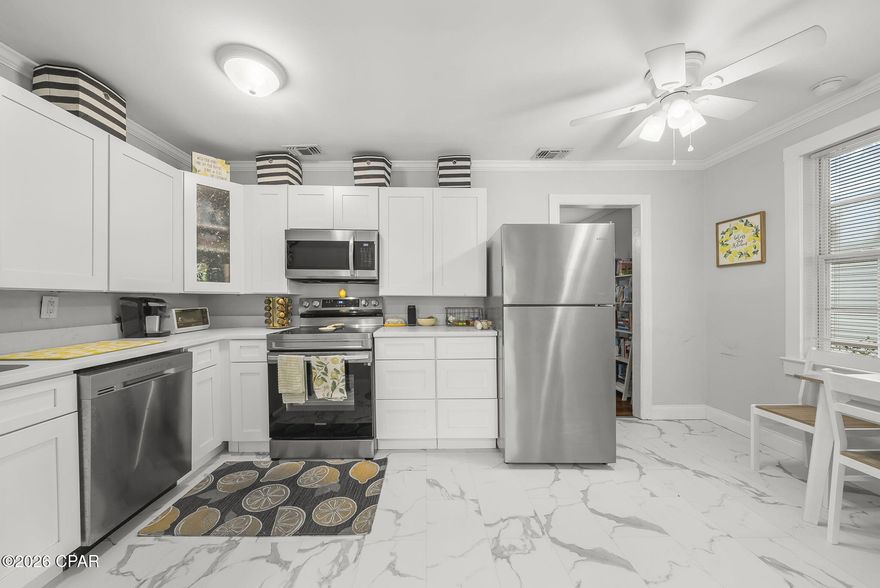 Coastal charm meets modern comfort just 1.5 blocks from the bay with public water access! Tucked away on a quiet dead-end street that leads directly to the water, this beautifully updated 2-bedroom, 1.5-bath home offers the perfect blend of character, convenience, and location.
Step inside to find real hardwood floors throughout the main living areas and tasteful updates throughout. The renovated kitchen with stainless steel appliances flows seamlessly into the living and dining spaces--ideal for everyday living or entertaining guests. Both the full and half bathrooms have been thoughtfully updated for a fresh, move-in ready feel.
Enjoy Florida coastal living year-round from the bright sun porch and cozy back porch, perfect for catching those relaxing bay breezes. Major systems provide peace of mind, with the HVAC and water heater both less than five years old, offering improved energy efficiency.
Outside, the fenced yard provides space for pets, play, or outdoor gatherings. Additional features include city water and sewer, and washer and dryer that convey. 
NO HOA and NO flood insurance required -- a rare and valuable combination this close to the water.
Ideally located just 20 minutes to Panama City Beach, 25 minutes to Tyndall Air Force Base, and only 5 minutes to the Navy Base, making this an excellent option for military relocation, first-time buyers, investors, or those seeking a peaceful coastal retreat.