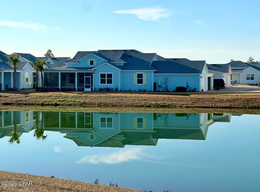 Rare Pond View Lot!!  You will love this incredible view! Professional photos coming Tuesday. This location is supreme and highly sought-after: a pond lot in Phase 6 B/C.  Welcome to your beautifully upgraded Dreamsicle floorplan. The million-dollar view encompasses the large pond and is surrounded by grassy area and a lovey treeline beyond. You will enjoy privacy and tranquility from your large screened-in front porch -- perfect for morning coffee--with two doors leading outside. As you walk inside this home, you will notice the amount of natural light throughout that shines through the large windows and the glass front door. In the den you'll enjoy vaulted ceilings, upgraded tile flooring, and a beautiful added fireplace for ambiance and warmth on those chilly evenings. The neutral paint pallet flows throughout the home, The owners added custom millwork throughout in the main living area, the dining room and primary bedroom. Special touches such as upgraded lighting and fans, crown molding, 8 foot doors,  and 5 1/4 in baseboards complement the millwork. Your family chef will love the beautiful open design kitchen, and the unimpeded view out of the dining room window. Upgrades include tall kitchen cabinetry,  a hidden trash cabinet, a separate pantry, crown molding and an upgraded tile backsplash. The quartz countertop extends onto the spacious island. The popular Dreamsicle floorplan offers a flex room that can function as an office, craft room, or extra den. This Dreamsicle has a split-bedroom plan, with the primary bedroom and bath separate from the second bedroom, flex room, and second bath at the other side of the home. The views from the patio are exceptional, where you can enjoy the magnificent skies our area offers. There are roll-down shades for privacy, and a TV mount for those perfect days when you want to watch tv from your porch. This Latitude Margaritaville cottage is just minutes from the world-class amenities offered in Margaritaville. The Town Square, just a golf cart ride away, includes an outdoor amphitheatre with live music each weekend, a large fitness complex, Fins Up Fitness Center, that has work out equipment as well as an indoor lap pool. There are many activities and events offered at the Last Mango Theater, the Clayground, the woodworking shop and more! There's even the Barkaritaville dog spa for grooming. Outdoor court games include pickle ball, tennis, basketball and bocce ball. There's also table tennis, ping pong, a putting green and more. Residents enjoy lots of outdoor seating with beautiful evening lighting while  mingling with friends and enjoying the music. And the best of all are the gorgeous resort-stype Paradise Pool (with daily live music in the afternoon) and the Bar and Chill restaurant with delicious food and drinks. Upstairs is the Overlook Bar where you can watch gorgeous sunsets over cocktails. There are so many walking trails and bike paths, and a dog park for your furry friends. All of this is adjacent to the Intracoastal waterway, which means the scenery is so beautiful. There's even a Kayak launch to get out and enjoy the water. Margaritaville Watersound is just seven miles from the gorgeous Gulf of America and the Emerald Coast. There's a new Publix being built now along with shopping that can be reached by a gold cart. Just ten minutes down Hwy 79 is Tallassee Memorial Healthcare facility, where the new hospical is being built. You will love the chill, laid back Margaritaville lifestyle inspired by the late Jimmy Buffet. Don't miss out on this perfect home in the perfect 55+ community!