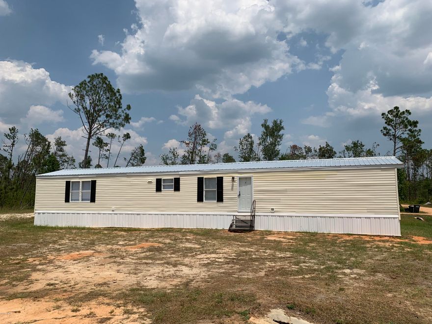 For Sale and Move in ready! - Spacious 3 bedroom 2 bath located north of Panama City in Fountain FL. This home was custom built by Clayton homes in 2005 with recent updates including recent metal roof system, new floor covering and fresh paint. Several financing programs are available including, VA, Fha and possible seller financing (ask an agent for details).