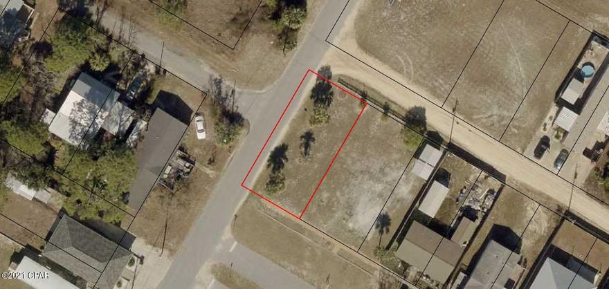 This lot is ready for your new home .  Elevation is high and dry, landscaped, irrigation in place. City water is allready connected to the other lot (3/4).    Property is landscaped etc and straight shot to the Carousel  Grocery store.  Take you golf cart and only 4 blocks from the beach as a straight shot. Lot next door is also available with all utlities in place.    Great investment opportunity  with lots already prepped. and ready to build on.