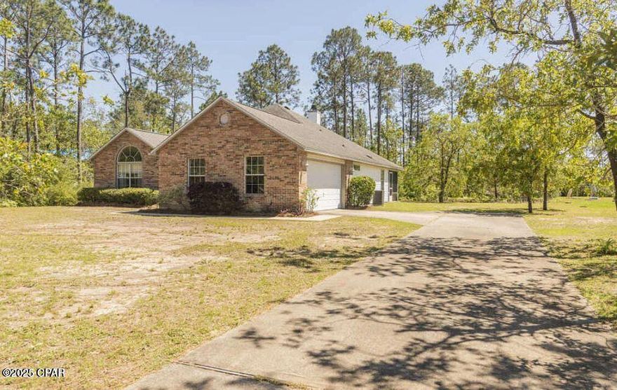 Welcome to your new home in the charming White Oaks neighborhood of Southport, FL! This beautiful brick home boasts 4 spacious bedrooms and 2 bathrooms across 1,848 square feet, providing ample room for family living or entertaining.
Worry free living with a brand-new HVAC & water heater, brand new microwave & new carpet in the living room too!

Special features to note include a spacious living room with a charming fireplace, large windows filling the interior with natural light, and a well-appointed master suite featuring a vaulted ceiling and dual sinks in the master bath. Enjoy lazy afternoons in the screened-in porch or host gatherings in the welcoming dining area. The home's thoughtful design ensures comfort with central heating and cooling, complemented by ceiling fans to enhance airflow. This home also offers substantial savings because it has a private well & septic tank, meaning NO water or sewer bills to pay!

The home also features a convenient attached 2 car garage and a large private backyard space on an acre lot. Located just 12 minutes north of Lynn Haven, you're never far from essential shopping and amenities. Don't wait—schedule a viewing today to make this wonderful home yours!