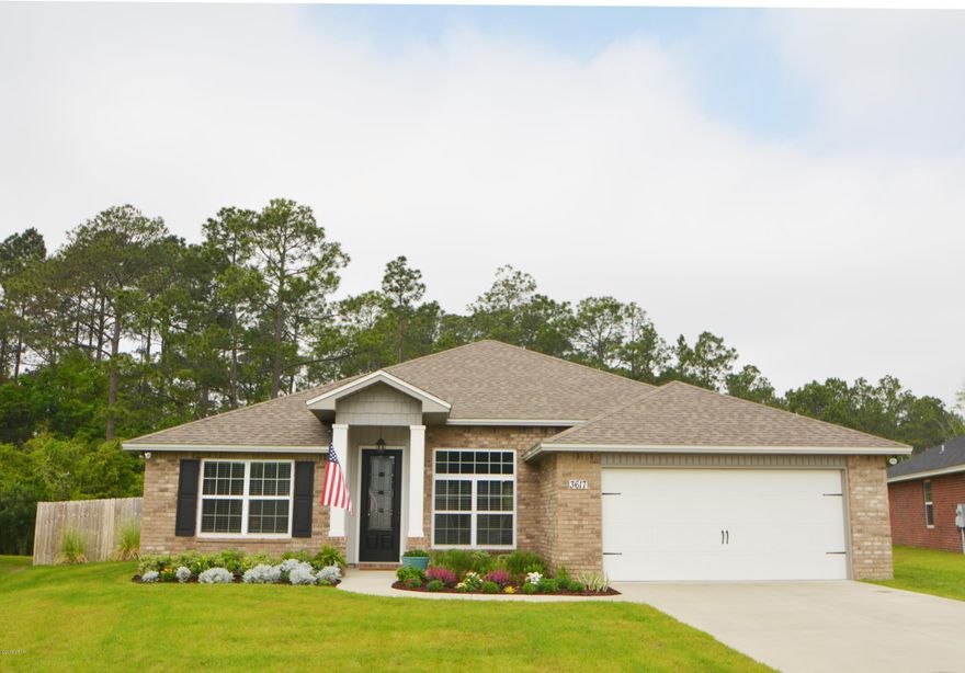 Tucked away in a quiet community, this gem of a home is conveniently located in town but hidden from the busy streets. The brick 4 bedroom, 2 bath home has been well loved and maintained to a high standard. Raised ceilings, recessed lighting, wood style floors, chair rails and crown molding are just a few of the quality touches throughout. The chef of the family will appreciate the beautiful spacious kitchen with tall dark wood cabinets, stainless steel appliances, granite counter tops, pantry and room to add an island.  The open floor plan is perfect to socialize with guests but the split bedroom layout allows your guests or children to have their own space while you retreat to your master bedroom or enjoy some alone time in front of the fireplace.  The Master bodes tray ceilings... a walk in closet and plenty of space for your large furniture set.  The En Suite bath has space for the couple to get ready together with his and her vanities, a garden tub, separate shower and water closet.  As a bonus, 3 additional rooms can be used for bedrooms and an office.  

Tired of being cramped in a small back yard? This oversized lot gives you plenty of room to spread your wings, play with the kids, fetch with the pup and start a garden.  Create your own staycation spot and add a pool! Backed up to the woods, you can appreciate the peace and quiet and escape having neighbors directly behind you.  

Azalea Place neighborhood is a well groomed community and is only minutes from shopping and Tyndall AFB.  It is zoned for top rated schools and is a quick drive to local Charter schools.  There is currently a termite bond in place and the sellers are offering a home warranty for the buyers peace of mind.  

All measurements are approximate and should be verified if important.
