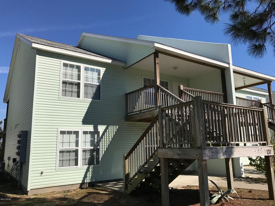 Great 2 bedroom 2 bath apartment located on the East end of Panama City Beach next to the Navy Base, and only a short drive to the beach.  This unit has new interior paint, and new laminate wood floors in the bedrooms.  Washer and dryer hook up, covered patio in front and large covered patio out back, and vaulted ceilings.