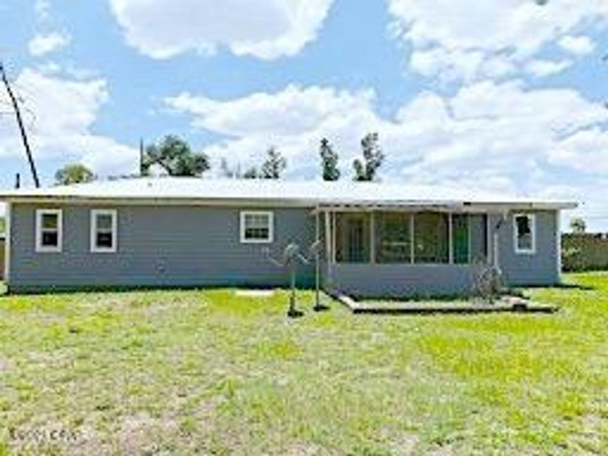 What a find, a 3/2 detached/single family home, sitting on a little over 1/2 acre lot, Flood zone X.    With some TLC this could be a great home for someone who has the time and experience to make the repairs.  Photo of  unfinished interior room is the detached garage.  Price is firm.