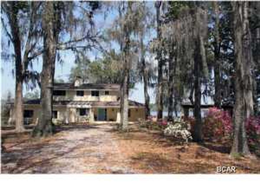 Just Reduced by $20,000.00! This Deerpoint Lakefront home setting is serene and private with 230 feet of waterfront footage. You are going to love the unique design of this 3 bedroom 3 bath home which features a stunning 2-story library, three fireplaces to enjoy cozy winter evenings and almost every room has a panoramic view of the Lake. Upon entrance to the home you will discover classic slate flooring and archways that provide a full view of the backyard and lake. This home was built with entertaining in mind - there's a wet bar within easy reach of the sunken living room and library and the dining area and kitchen are quite large which allows for plenty of gathering space for family and friends. The kitchen also has a breakfast bar, large pantry and lots of cabinets so it's