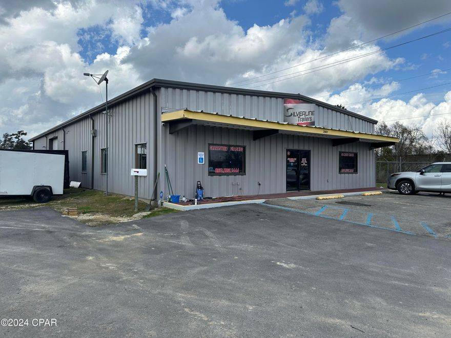 INVESTMENT PROPERTY This is income producing property that has a current lease valid through DEC 2025. Commercial building for sale . This is a large metal building that was previously used as an AG retail business. It is 5,700 sq ft, with front desk and bathroom. 2500 sq ft of it is heated and cooled and the back 2500 sq ft is an enclosed warehouse with two 12 foot roll up garage doors. The center of the warehouse is 14 1/2 ft in height. On the back side of the building there is a covered paved area with loading dock. The lot is over 2 acres and in close proximity to the railroad and other retail businesses on Penn Ave and Hwy 90. This is a high traffic location with easy access to Hwy 231 and I-10.