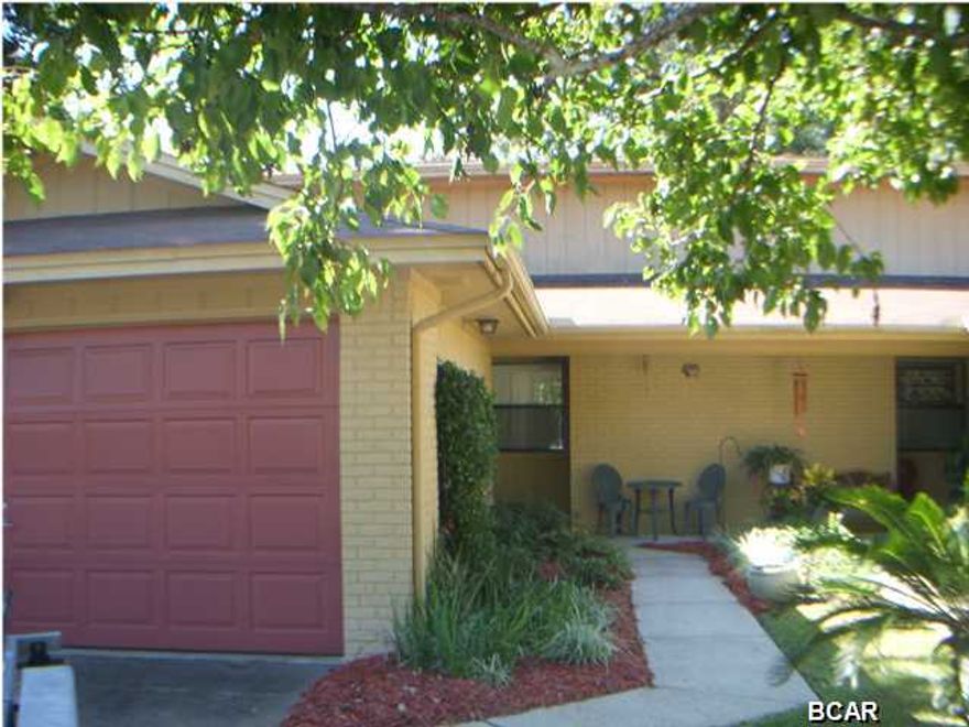 Bring your boat and move into this fully furnished townhouse on the canal that leads to Goose Bayou and out to the Gulf. This one level bright and cheerful townhouse has been completely updated using professional decorators. All you need is your clothes, everything conveys, except the boat and trailer. You can hop on your boat from the 10,000 lift or just sit and enjoy the view from the deck. If you feel like a stroll head across the street and enjoy Sunset Park. This home is close to Hwy 390 for convenience and yet secluded and quiet on the canal. Come see for yourself. This is a gem. All measurements are approximate.