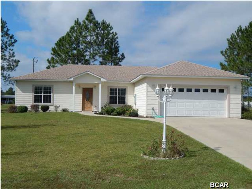 Florida Sunshine awaits you in this clean, well maintained, 3/2 home. Nestled in between Altha and Marianna Florida, you will love coming home to your quiet & peaceful retreat. This is a custom built home with many extras that are waiting for you to come and see. Home is so well maintained, it appears as though it was just completed yesterday. This large corner parcel is landscaped for easy maintenance and the extra large driveway will accommodate 6 vehicles at once. The 22X22 finished garage has extra storage above and a workbench and shelving. The sellers are offering many extras that may stay with the home (too many to list). This is a versatile, multipurpose home, great for retirement, first time home buyer, investment rental, it can be whatever you want it to be. This home MUST  be shown to appreciate the value. 7 minutes to Altha, 17 minutes to Marianna. Close to the caverns, springs, golf, shopping,hospitals, schools. Surrounding areas have some of the best fishing in the country. Sellers are motivated and ready to make a deal. All info is believed to be correct, if important, buyer should verify.