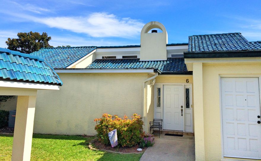 ***PRICE REDUCTION***Rare find in Cove Condo complex, park your boat at the dock on the weekends.This is one of the townhouses that are located just east of the main building. A large 2 bedroom 2 bath unit, located on ground floor, no steps, no elevators, lots of privacy. Enjoy views of St. Andrews Bay from the living/dining combo or on the heated & cooled, glassed-enclosed patio. Features include a Master Suite with a huge dressing room; a great kitchen with plenty of cabinets, side by side refrigerator, range and cooktop; separate laundry room with full size washer and dryer; Tile floors with accents, wood burning fireplace; vaulted ceiling in living area; 2 covered assigned parking spaces. Large Storage closet conveys with unit. All measurements, dimensions, amenities, fees, etc., should be verified if deemed important.