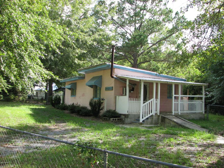 Great starter home or rental opportunity located only minutes from town. This property has a nice fenced in yard and multiple out buildings. The home features a nice size living area with two bedrooms and a bath. There is a nice screen porch located out back. Home is convenient to schools, dining, and shopping.