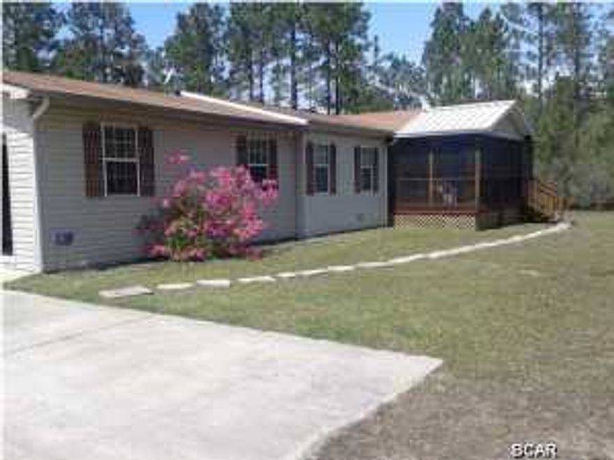 This 3 bedroom, 2 bath manufactured home sits in the middle of a 2 acre lot. The interior features wood and tile flooring, newer appliances, open design and raised ceilings. The exterior offers large yard, screened patio, carport and garage.
