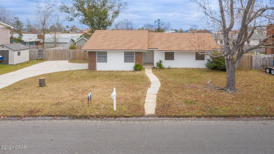 If the sunset and being close to the water is what you seek, look no further than this spacious, newly remodeled, 3 bed 2 bath home just a short stroll away from the bay and Venetian sunset park, and a short drive to the beach. You will be living the dream in this home with a new roof, flooring, fixtures and many extras including an amazing back patio with pergola just through the French doors in the separate dining room. Great room with beautiful brick fireplace is perfect for entertaining on cool winter nights. Kitchen with sink window, breakfast bar, lots of cabinets and storage. Appliances to stay including washer/dryer!  Main bedroom with extra large closet, en suite with tub/shower combo. No HOA! No carpet! Double car garage, big back yard is privacy fenced, and plenty of parking. Come and see this move in ready home today, fall in love and start this new year out right!