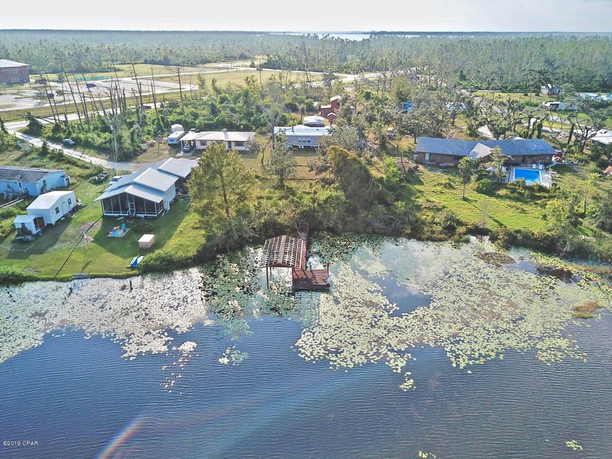 ** Motivated Seller, Bring all offers!** Your waterfront oasis awaits! This one of a kind property is a must see. Highlights include over 1.6 acres, roughly 196' of waterfront footage, a private dock, private pond in the front yard, a large barn, and a detached shed/carport. Conveniently located to great schools, shopping and dining. Whether you like boating, fishing or just relaxing on the water, this is the perfect property for you. The home boasts over 2,300 sqft of heated and cooled space along with 4 bedrooms and 2 bathrooms, A computer room and large utility room for additional space and storage. You will love the large master with his and her walk in closets. Bring out your inner chef in this spacious kitchen with an updated range hood, built in wall oven, plenty of cabinets and counter space for preparing your favorite meals. You will enjoy your large dining room with sliding glass doors over looking the lake. The large living spaces are great for relaxing with family and friends.  This home is a must see! Call for more information or to schedule a showing today!