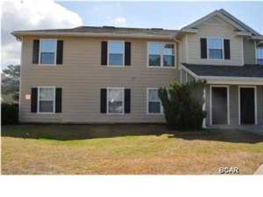 Practically brand new 4BR/3BA ground floor unit in Nautilus Cove. All new carpet, freshly painted and the kitchen has new cabinets and stainless steel appliances that compliment the existing granite counter tops. The split-bedroom floor plan is perfect for a growing family and there are two masters, one with a walk-in closet. There is also plenty of interior storage. Nautilus Cove is a gated community very convenient to schools, Pier Park, restaurants and more. On-site amenities include a resort style pool, exercise room and clubhouse, several barbecue grills and picnic tables, and a children's playground. All info is approx. and must be verified by Buyers if important. *There are certain procedures to buy this property. Your real estate agent can help you with the details.