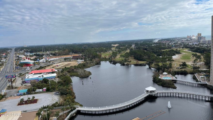 CURRENTLY UNDER CONTRACT, SELLER ACCEPTING BACKUP OFFERS. PANORAMIC view of the lagoon, bay, east part of Panama City Beach, and a partial, distant view of the Gulf and beach! Enjoy coffee and breakfast on a huge (10X31) balcony  and see the beautiful sunrise. This condo is a spacious 3BR 3BA and built in bunks with over 1600 sq ft. It's perfect for full time residency, or will make a great second home, or vacation rental. It comes partially furnished (please ask your agent for the list provided). The Kitchen is stunning with white cabinets, new stainless steel appliances, granite counter tops, back splash, new sink and faucet. The master bedroom has balcony access and a large en suite including a double vanity with new faucets, garden tub, and walk in shower. Water heater: 3 years old.