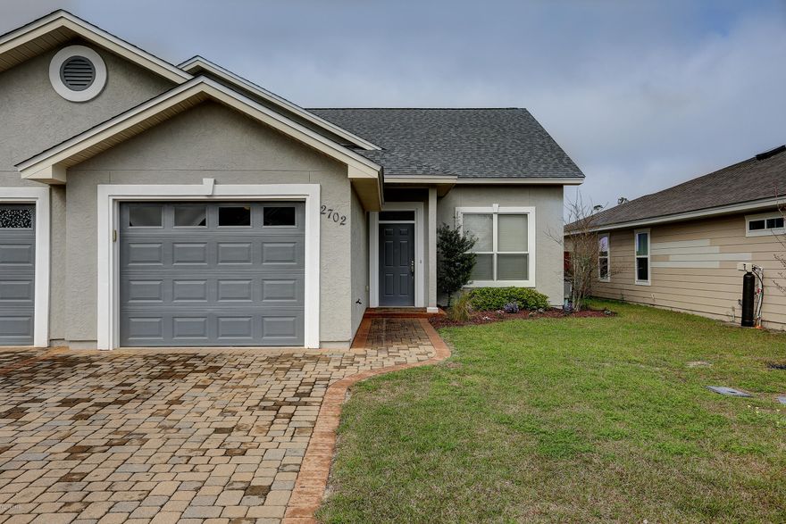 Now is the time to buy!!! This beautiful townhouse is just minutes away from great schools, shopping and entertainment. Lynn Haven is a very desirable community to raise a family. Priced to sell with upgrades galore! 3 bedrooms with the master suite located on the bottom floor offering a large walk-in closet with seperate vanity area and a jacuzzi tub w/shower. The kitchen, dining, and family room are all open to each other, the layout is perfect. The kitchen offers custom stained cabinets, solid surface countertops, and stainless appliances. Tile throughout except on stairway and bedrooms.  Plenty of storage including large attic space over garage. Backyard has a privacy fence and is very spacious. Please verify all sizes and important information. Call for your private showing today.