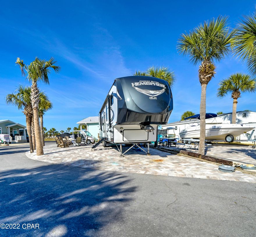 Check out this beautiful corner lot with pavers in popular Venture Out. This lot is in the perfect location within the resort. It's super close to the back pool and boat launch area. This lot also has a good size storage shed with room for washer/dryer. Build your dream home or bring your RV! This one won't last long as lots are highly sought-after! Venture Out offers BOTH beach and bay access! The resort also has 2 pools, tennis, golf, shuffleboard, playground, basketball, fishing pier, boat dock with slips & boat ramp. Venture Out is a golf cart community that has exploded in popularity within the last few years. A gated community that's great for full time residency or just to vacation. 24-hour security & friendly atmosphere.