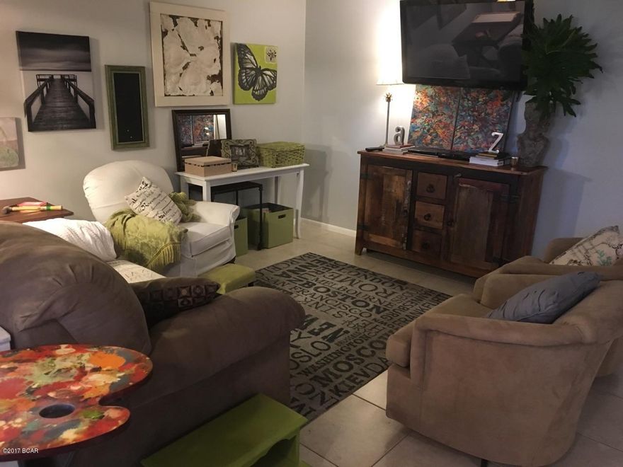 CHARMING, COMFY, COZY, all come to mind when describing this condo unit. This is a premium location on the GROUND FLOOR, and CORNER UNIT, which offers easy access and creates a fantastic nook area out back overlooking the golf course and a beautiful pond. The unit is 1 bdrm & 1 full bath, plus an area converted with bunk beds and a sink/vanity. The floor plan is open with the kitchen flowing into the living room & the enclosed sun room viewing the golf course, altogether creating a very spacious feel. This is a beautiful unit, professionally remodeled not too long ago, and is being sold partially furnished. A short walk out the door you'll find the marina with an array of yachts and incredible sunsets, plus there is tennis,golf,boat rental,dining,salon & more.