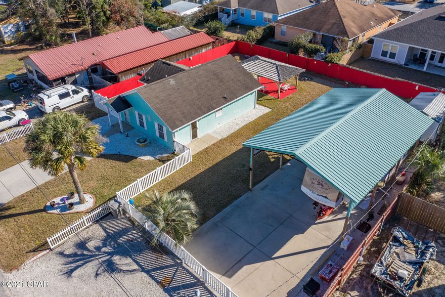 DOUBLE LOT!!!! Great Chance To Own a Wonderful Beach Cottage On the West End! And a Nice 24 X 36 Pole Barn on a Second Lot! These Don't Come Available Often! Park Your RV or Boat. Has Electric, Water, Septic, Natural Gas. Outdoor Shower. Also has a 10 X 16 Cooking Shed.  House has Vaulted Ceilings, Large Closet, Breakfast Bar. Furnished Mostly, except Artwork and Personal Items. Entertain Guest Under a 20 X 12 Cedar Shake Pavilion with a Firepit!! Vinyl Fencing in the Front and Privacy Fencing in the Back. Plenty of Concrete Drive Areas to Park Multiple Vehicles. Irrigation Well and Sprinkler System. Cooking Shed is Equipped With Deep Fryers, Hood, Exhaust Fan, Refrigerator. If dimensions or details are import, please verify.
