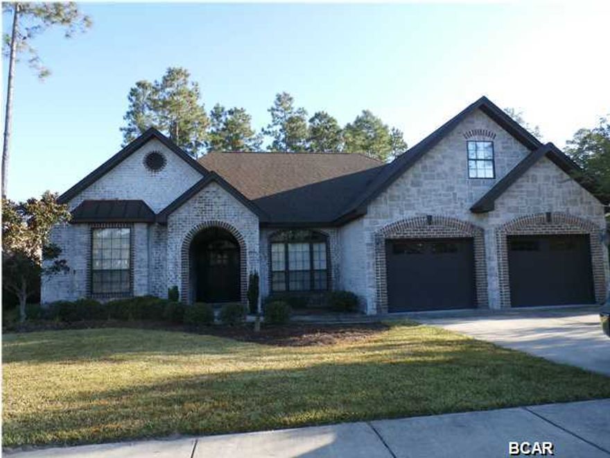 Beautiful Stone and Brick exterior. Hand Scraped Hardwood floors. 10 ft. Ceilings, Custom Tile work, Granite Countertops, Stainless Appliances and Custom Hickory Cabinets. Rubbed Bronze Fixtures and Upgraded Lighting. Granite Gas Fireplace, Custom Built-in Bookcases, Crown Molding & Media Center. Spa Soaker Jacuzzi Tub & Walk in His & Her Closets, XL Windows and Custom Blinds. Gunite Saltwater Pool w/Removable Safety Fence. Has a 6 ft. Vinyl Privacy Fenced Yard and Sprinkler System using Free Reclaimed Water! Walk to Top-Rated Bay Haven Charter Academy. Hawks Landing is a much sought after neighborhood with greenways, sidewalks, underground utilities, upgraded street lighting. Centrally located in Lynn Haven, FL. Close to shopping & dining.