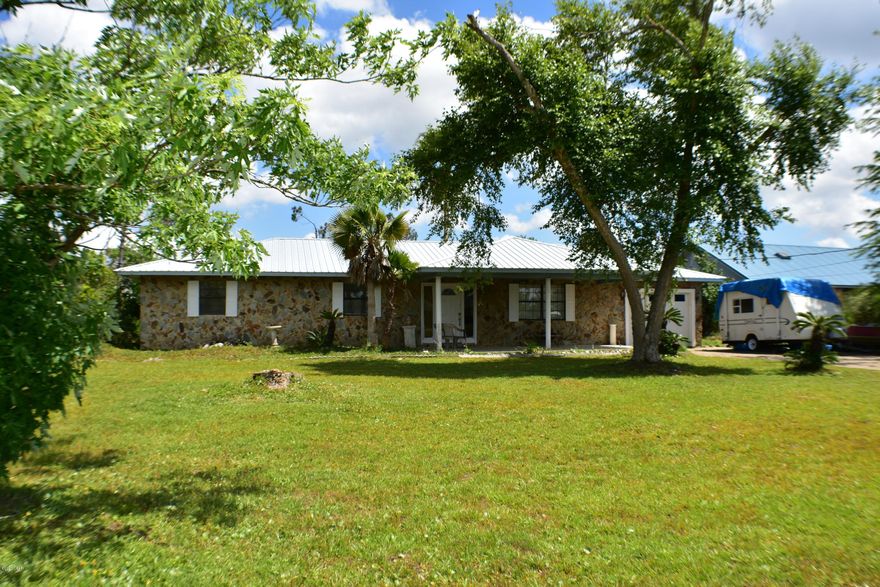 CURRENTLY UNDER CONTRACT, SELLER ACCEPTING BACKUP OFFERS.  PRICE REDUCTION!  MAKE THIS YOUR DREAM HOME!  Deerpoint Estates home with pool!  This is a 3BR/2BA home on a half-acre lot.  The metal roof was replaced in 2017.  Features include a hot tub inside the screened porch, and in-ground pool, one car garage, fireplace and lots of storage.  This is a great home for a growing family and you're close to Deerpoint Lake and the public boat ramp.  All info is approx and must be verified by Buyers if important.