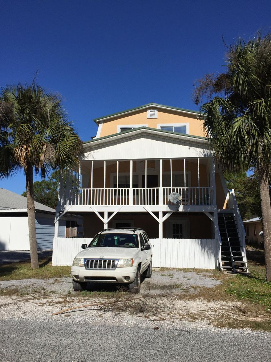 Seller motivated and looking for cash offer.  Great opportunity and great price... This large beach home could easily be converted to a duplex offering 3 bedrooms, full bath, living/dining combo area and full kitchen downstairs, plus an addition 2 bedrooms, 1.5 baths, living room, dining room and kitchen on the top two stories. Located just one block to the Grand Lagoon and a short walk to the beach.  Some TLC and personal touches will make this house a home.  Lots of possibilities whether you're looking for a large home or choose to live in one part and rent the other.  Call before its gone!