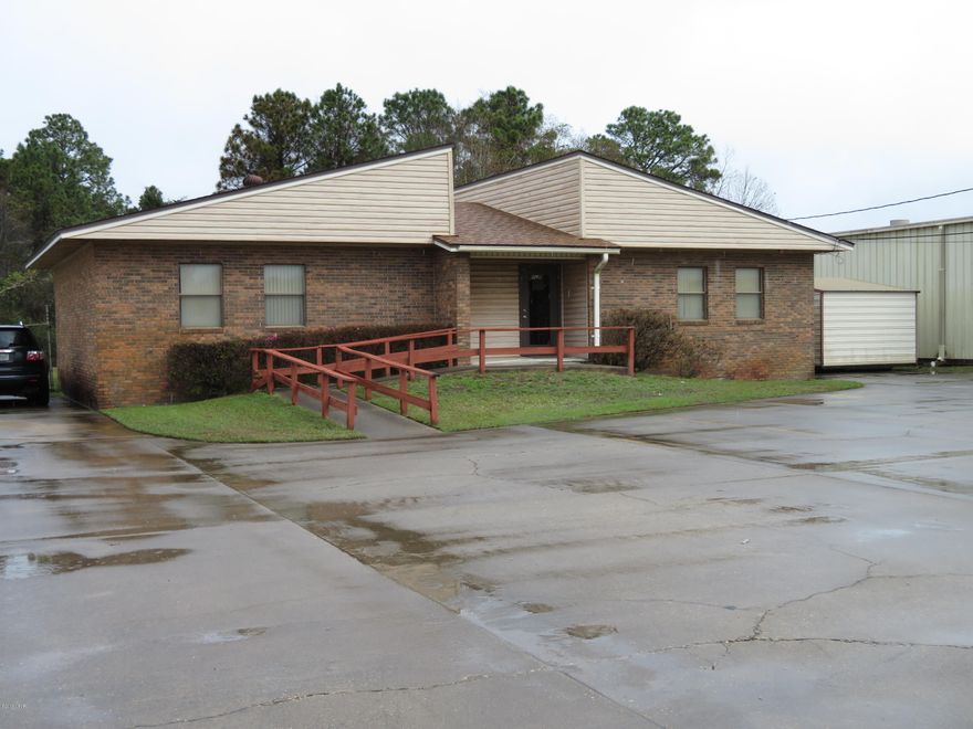 Very well maintained office building that is currently home to a general office use professional organization.  Site is perfect for any general office user or small contractor or service related businesses. The building includes large reception area, 3 offices (one is large enough for use as a conference room - 14 Ft.X 14 Ft.), media room, large meeting/conference room (32 Ft. X 16 Ft.), full kitchen area (refrigerator, microwave, stove & dishwasher convey) and 2 restrooms.  Large fenced yard area is perfect for outdoor storage, with access from both sides of the building.  Site has public water, private septic and is zoned Industrial (IND-2) in unincorporated Bay County.