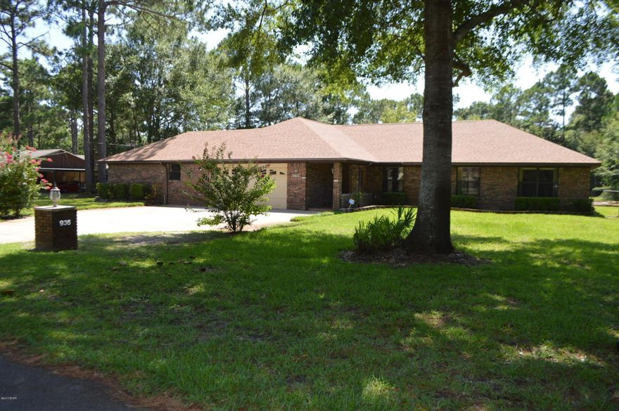 CLEAN AS A WHISTLE! Well maintained brick home on almost an ACRE of land! The main home is 2096 sq ft with an additional workshop under the same roof. It would not be much to convert that space to a theatre room or heated and cooled game room, etc. The home features a split floor plan, vaulted ceilings, upgraded cabinetry, kitchen island, new lighting and more. The roof is BRAND NEW! AC only 5 years old and HWH only 2 years old. There is a half bath off the back screened room that is perfect for the pool guests. In addition to the screened patio, there is a covered patio as well as an open patio all overlooking the INGROUND POOL. The back yard is HUGE and leads to a separate alleyway with its own gate for access.