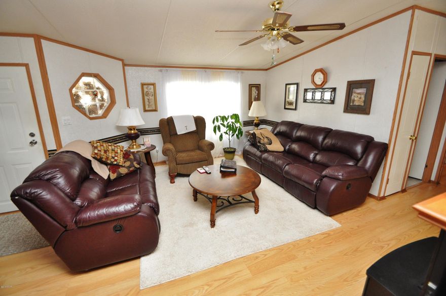 Amazingly clean 3 bedroom home on three lots, close to Tyndall AFB. This home has wood floors thoughout, fireplace, huge 12x36 enclosed patio deck. Very wide driveway with 10x10 storage unit attactached to 2 car carport. The house has its own well along with city water. Custome blinds are included. You are only 1/2 mile from John B Gore park wich has a public boat ramp. The driveway and carport have room to keep your boat, jet skis or kayak's. Go out catch your dinner come home and clean them and cook them on your huge deck...OWNER IS VERY MOTIVATED.. all sixes are approvimate please measure if important.