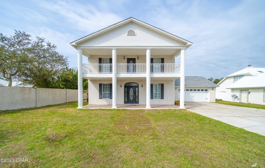 UNDER CONTRACT W/ CONTINGENCIES; SELLER ACCEPTING BACKUP OFFERS.
Easy Show!!! Spectacular newly remodeled home located on over a quarter acre in one of the most prestigious, gated neighborhoods in Panama City Beach - Palmetto Bluff. Palmetto Bluff is located on a rare coastal dune lake, Lake Powell. Lake Powell outfalls right into the Gulf of Mexico and provides ample fishing, boating, paddle boarding, and activities for watersports enthusiasts. The custom finishes of this home are amazing - brand new LVP flooring throughout, shiplap bordering fireplace, new paint, custom backsplash in kitchen with new cabinets and new appliances, new tile and bathroom fixtures, quartz countertops, new vanities, new toilets, two brand new HVAC units, all new fixtures throughout the home, and new lime washed exterior paint. Guest bedroom on left just off the living room.
Two bedrooms upstairs with double sink vanities.
All bedrooms have a private bathroom.
Kitchenette area upstairs at top of the stairs
The master suite consist of a walk-in closet and master bath with double vanity. From the second floor you access the large covered veranda which offers views of Lake Powell.