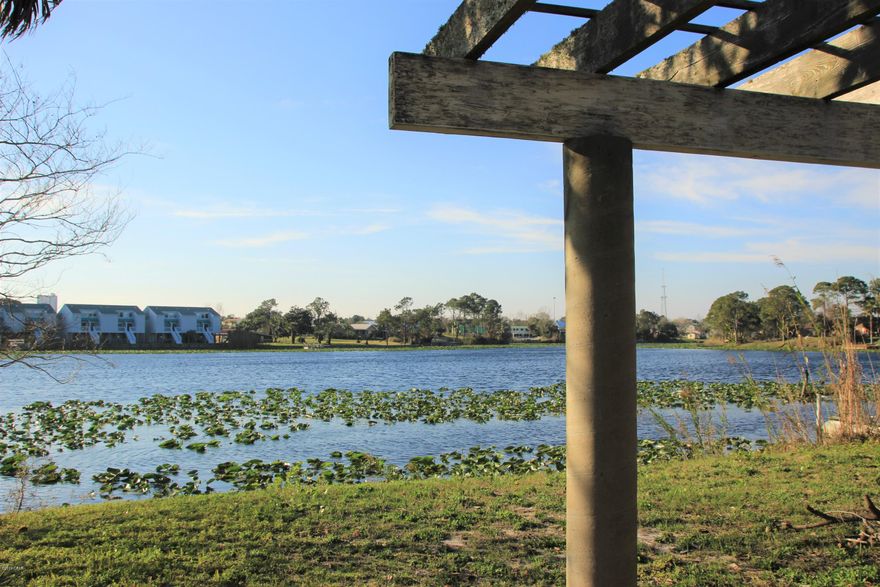 When they say Location, Location, Location... this is the house they are talking about. This is probably one of the coolest places to own a house in PCB. You are a five minute walk to Pier Park, the beach is right across the street, and you have a 30 acre lake in your back yard. This is a huge ranch style house on a double lot, with a one car garage. Homes like this do not come on the market very often. The home needs some updating, but it has good bones and the roof is only a couple of years old. Do yourself a favor and come see this house for yourself. There is a ton of potential in this one. Sale is 'As Is' and all information is to be verified by the buyer. NOTE-Two bathrooms where combined into one, so property is now a 4 bedroom 3 bath.