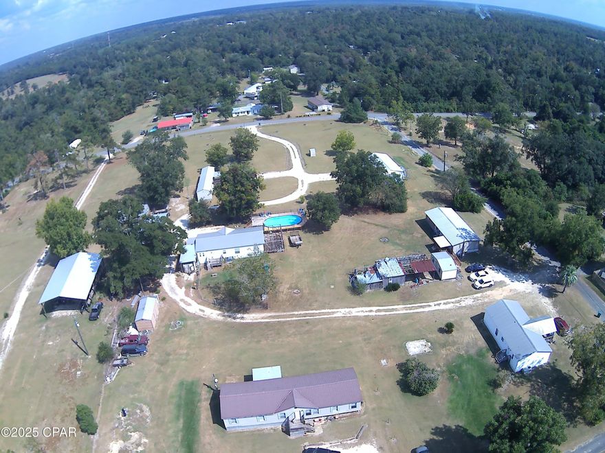 Great investment opportunity in a mobile home park located on 4+/- acres featuring five double-wide homes and one single-wide home, with capacity to accommodate two additional homes. Current monthly income: $6,600. The park is well-positioned for growth, with ready-to-build potential to increase occupancy and revenue. Ownership includes established rent collection and a stable tenant base, making this a solid cash-flow asset for an investor. There is a total of three parcels.  Contact for details on lot layouts, lot rents, and any available improvements or expansions.