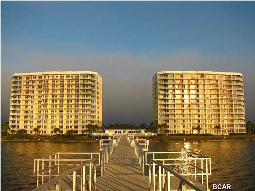 Price reduced $45,000! Seller is firm at this great price! Hibiscus By The Bay - Located on St Andrews Bay and the Intracoastal Waterway. Spectacular views from this huge 4br/3ba bay front penthouse condominium, with almost 3,000 sq. ft. of living space, a huge 400 sq. ft. balcony and a private protected marina. This community is especially designed for recreational boaters, fisherman, kayakers and jet skiers. This is a first class waterfront community situated on an elevated 10 acre peninsula with 600 feet of water frontage on beautiful St. Andrews Bay. Penthouse condo unit 1203 Tower 2 is on the 12th floor. This condo has 2908 sq. ft. of living space, 4 bedrooms, 3 baths, and is an east facing unit with 10 ft. ceilings, lots of natural light and spectacular views! The modern kitchen features high end Viking appliances and granite countertops. This condominium features a master bedroom and living area that are both waterfront. Both have sliding door access to the large spacious balcony and expansive views of St. Andrews Bay to the north, east, the Intracoastal Waterway including the Hathaway Bridge. All the units in this complex face east so you get a GREAT sunrise. As the day progresses you get shade on your balcony. What a great place to have coffee and breakfast! All 4 bedrooms have wall to wall carpet. The kitchen, maintenance area and bathrooms have ceramic tile and the master bedroom, living room and dining area all have crown molding. The community has a pool, hot tub, outdoor grills, an awesome 500 ft. pier, fitness room with a view, meeting-library room, owner's lounge with a view and a tennis court with a great view. A garage and boat slip are available for purchase. They are not included in this price but can be purchased at an additional cost.