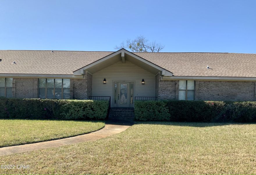 Excellent location in Lynn Haven just 1 block from Leslie Porter Park and boat ramp. This three bedroom two bath brick home is located on a large corner lot and close to shopping, churches, restaurants and in some of the best school districts in the county. As you enter the foyer of this home you overlook a massive Great room with vaulted ceilings and a large brick fireplace. To the left is a formal dining room that leads to a modern island kitchen with a breakfast area. Off from the kitchen is a large laundry room with spacious pantry and access to an oversized double garage. On the opposite end of the home are the three bedrooms and two full bathrooms. MORE The home has a well that serves the sprinkler system. There are plenty of oak cabinets with an large island. The home is total electric and the roof is just over a year old. All of the rooms are large with a garage that is over 30 feet x 22 feet wide. You find some pleasant surprises like a double vanity in the full bathroom and privacy baths and toilets in both the full and master bathrooms. Extra closets are always appreciated whether its the two at the front door, extra wide closets in the laundry or a walk-in closet in the second bedroom. In the back yard is a large attached patio with an additional covered detached patio away from the house that would make a great outdoor barbecue pavilion. This house is move in ready.