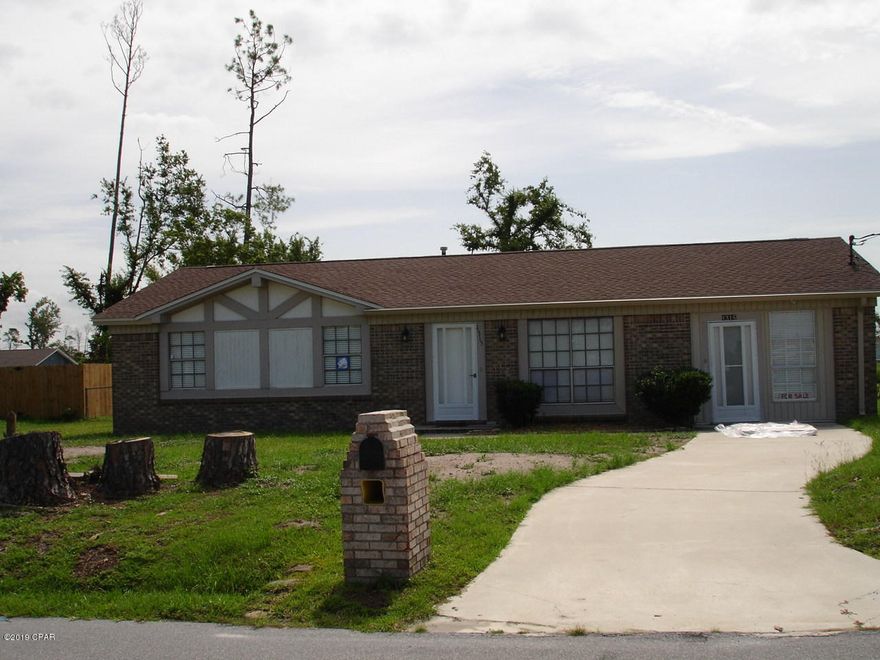 This quaint four bedroom with 2 bathroom home is on a large 100' x 150' lot enclosed by chain link fencing located in Lynn Haven. The kitchen features vinyl plank flooring to capture the beauty of the cabinets and new refrigerator. The neutral color carpet and  painted interior will compliment a wide range of furnishings. One other feature of this well maintained home is a tank-less water heater with a central gas heat and central air conditioning system.