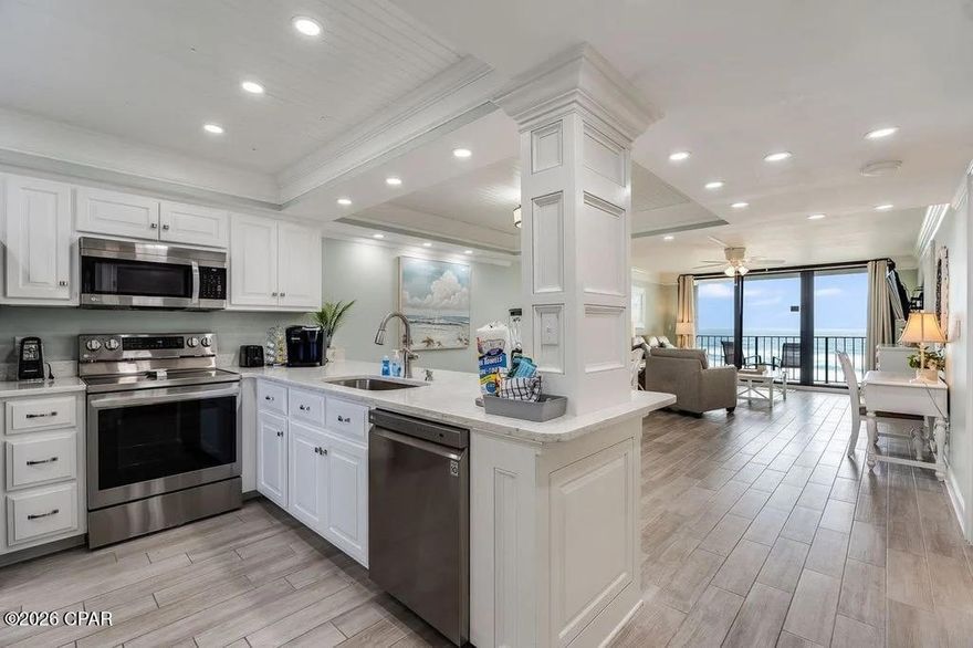 Experience the ultimate in coastal luxury living or seize a rental investment opportunity with this stunning, newly listed residence at Edgewater Beach Resort in vibrant Panama City Beach, Florida. This immaculate condo was meticulously remodeled from the studs up in 2022, showcasing exquisite upgrades throughout. Step inside to discover premium tile plank flooring, elegant wide trim and crown molding, designer lighting, and smooth ceilings that create an airy, inviting ambiance. The kitchen has been opened and features custom cabinetry, sleek quartz countertops, ceiling upgrade and stainless appliances. The spa-inspired bathroom boasts a modern tile shower and upscale fixtures. This floor plan highlights a sought-after Gulf-front bedroom with beach views, floor-to-ceiling windows, and a private balcony for savoring sunset skies and the soothing sound of ocean waves. Every detail has been considered for comfort and style, including new doors, contemporary furnishings, a high-efficiency water heater, and AC system. Exclusive access to beaches, pools, hot tubs, restaurant, market, pickleball, tennis, fitness center, golf+pro shop, kids splash pad, game room—all within a gated, beautifully maintained resort. Convenient building-side parking, vehicle charging, and parking for RVs, boats, jet skis, trailers. Pet-friendly for owners, with both the dog beach and park just minutes away. Whether you're searching for a personal family retreat, an active second home, or a high-performing rental property, this exceptional villa delivers the beach lifestyle you've dreamed of.
