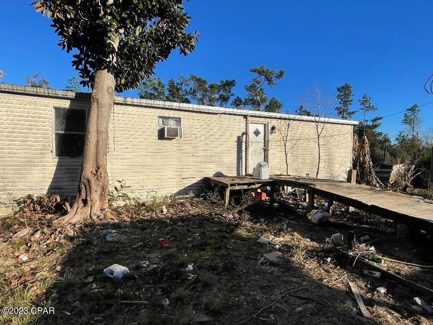 CALLING ALL INVESTORS!! This double wide mobile home is in need of some TLC. This property contains over 1.5 acres with other parcels for sale nearby! This property also offers two electric poles ready for hook up and a 250' deep well.