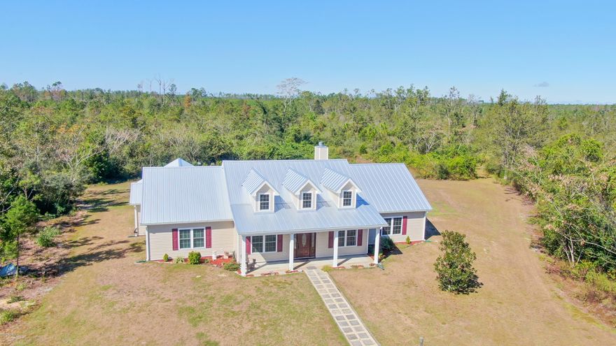 'CURRENTLY UNDER CONTRACT, SELLER ACCEPTING BACKUP OFFERS' Welcome to country living at its best.  This beautiful 2600+ sq.ft. well maintained home is situated on 30 acres, features 4BR 3.5BA w/bonus room leading out to a covered porch where you can enjoy relaxing days/nights entertaining family/friends in your very own jacuzzi and above ground pool w/ new liner. This home also has a new standing seam metal roof, new windows, new siding, insulation, new gutters, a barn with 3 stalls and a pond. Call today to schedule your showing. Measurements are approximate, verify if important.