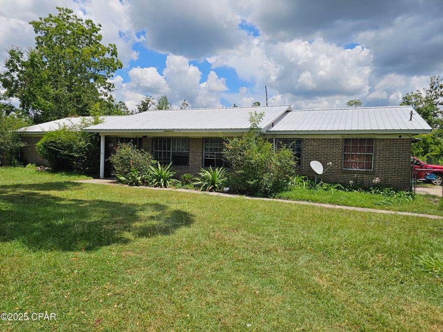Investor Special - Full Rehab Opportunity on 1.02 Acres!

This all-brick 3-bedroom, 2-bath home offers 1,768 sq ft of potential with solid bones and a newer roof (replaced in 2019). Features include a bonus room, utility room, and a covered back porch overlooking a spacious backyard in need of cleanup. A large metal and wood-framed shop with steel beam trusses is also on site and needs repair. There is also another structure for storage or perhaps remodeled into a small dwelling. Sitting on just over an acre, this property is perfect for those looking to restore and customize. Bring your vision and make it shine!