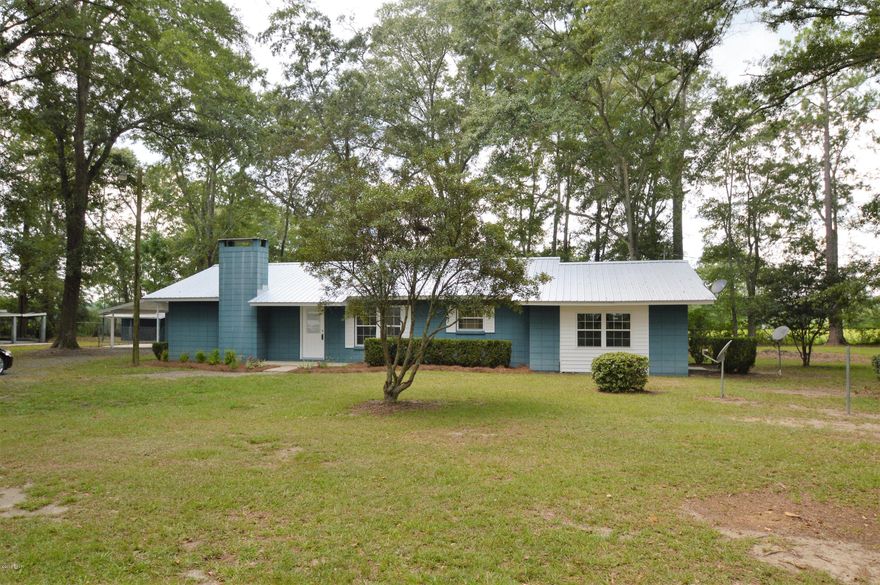 Peaceful Country Setting on 2 acres of land. Newly renovated home has so much potential. Nicely wooded yard has a number of outbuildings. Detached building with a little work could be mother in law quarters or man cave. Home has 3 bedroom 2 baths with vinyl plank floors. Living room has fireplace and open to dining room. Large den could easily be made into 4th bedroom. New stainless steel appliances. A Must See!!!!!