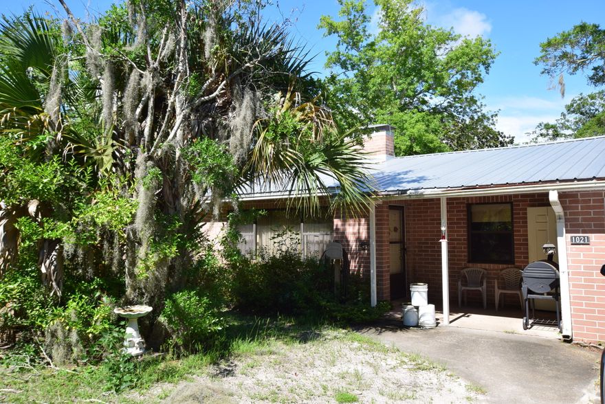 Here's your opportunity to own over 0.6 acres in town and a stone's throw from a bayou and the bay. More than enough room for a garden, large workshop, or all of your toys! Access from E Park St and 4th St. Very sturdy brick home with a metal roof and recent HVAC. Move in ready, but does need some work in areas. With just a little bit of polish, this diamond can be shining in no time!
