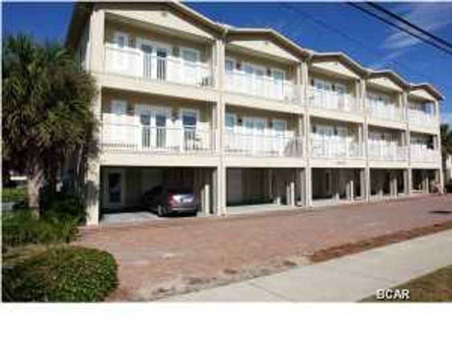 Just Listed! This 3 story end unit townhome is located directly across the street from public beach access and offers awesome beach views! This unit is sure to impress and features 3 bedrooms, 3.5 bathrooms, attached carport, and community pool. Each bedroom has its own bathroom! This quaint development of 9 units offers an excellent location within walking distance to bars, restaurants, and shopping! This unit would make an excellent primary residence, 2nd home, or weekly rental. Call today for appointment! All info & measurements are approximate and must be verified by buyer.