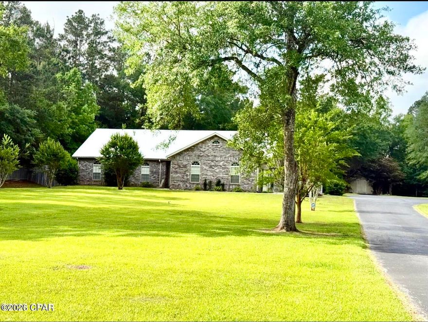 Spacious Brick Home on Nearly 10 Acres Inside Marianna City Limits

Welcome to your private retreat in beautiful Marianna, located in desirable Jackson County. This well-maintained 3-bedroom, 4-bath brick home sits on an impressive 9.79 acres, offering the perfect blend of space, comfort, and convenience--all within city limits.

Step inside to a large, inviting family room and kitchen combination featuring a cozy fireplace--ideal for gatherings and everyday living. The home also boasts a generous Florida room, along with an additional enclosed porch that provides even more space to relax and enjoy the peaceful surroundings.

The primary suite offers a unique and functional layout with separate his-and-her bathrooms, providing both privacy and convenience. A fourth bathroom with a shower is conveniently located near the laundry area.

Outdoors, you'll find a fenced backyard with a swimming pool, perfect for entertaining or unwinding. The property also includes three storage buildings and a pole barn, offering ample space for equipment, hobbies, or additional storage.

For added peace of mind, the home is equipped with a whole-house Generac system, ensuring you'll always have power when you need it.

This rare property combines acreage, amenities, and location--making it a truly exceptional opportunity.
