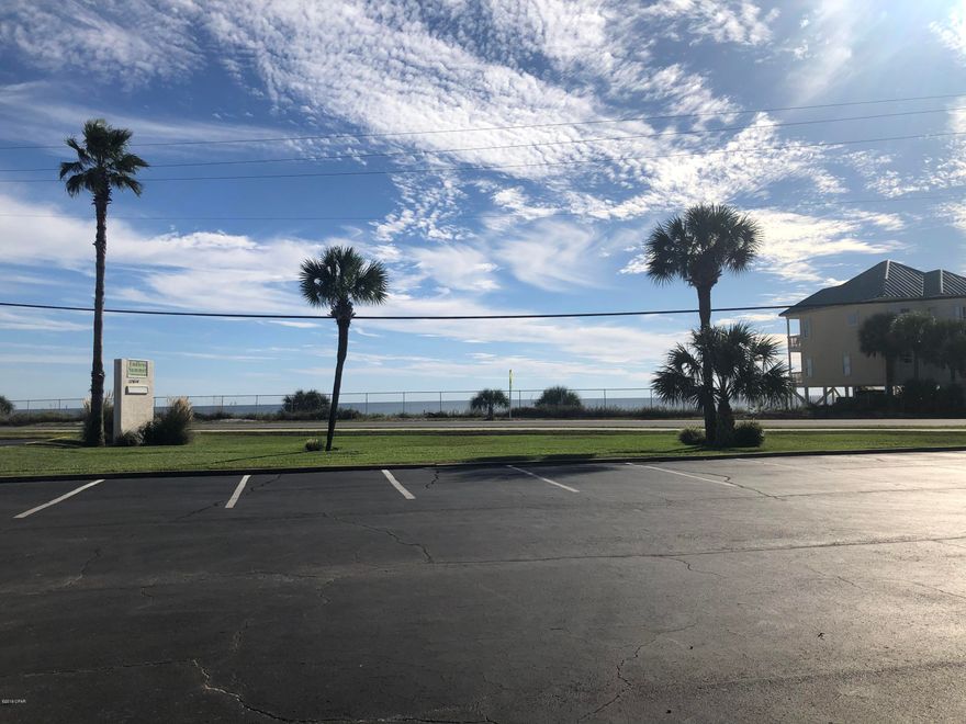 Unbeatable Gulf views from this ground floor condo in Endless Summer directly across from beach access 70. Gulf front views without the Gulf front price. This condo is only a few steps from the white sandy beach and no stairs to climb.  This condo offers a large bedroom with views of the courtyard. Endless Summer is centrally located 1/2 mile past 79 and Pier Park and has 2 swimming pools, clubhouse, shuffleboard, hot tub and picnic area with barbecue grills. Don't miss your chance to own a piece of paradise!