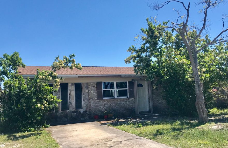 **Huge price drop**Awesome opportunity to purchase a fixer upper with a new roof and minor hurricane damage. All Brick house with newer energy efficient Miami Dade code hurricane resistant windows and sliding back door with a view into the huge back yard. Open floor concept kitchen, bar, dining room and living. Plenty of closet and storage space throughout this large 4 bedroom 2 bath house. Spacious laundry/utility room with lots of space and shelves. Ceilings and insulation were removed as a precaution, section of wall in the great room and coat closet was also removed. Close to Tyndall AFB, parks and shops. House is being Sold AS-IS, Where-Is, and is priced accordingly. Seller to make no repairs, demolition, disposal of debris, or clean up. All  measurements are approximate.