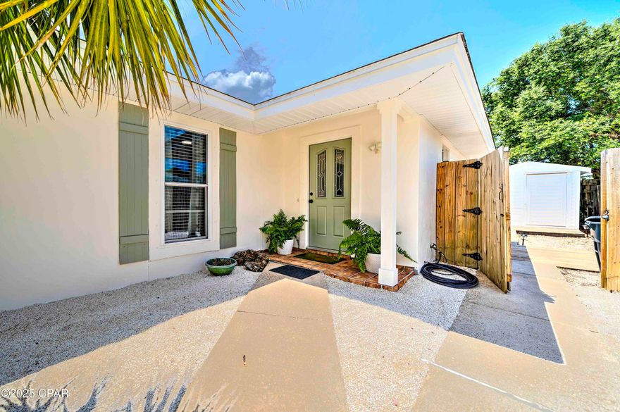 CURRENTLY UNDER CONTRACT, SELLER WILL CONSIDER BACKUP OFFERS - Experience the ultimate in coastal living with this beautifully updated home located in Panama City Beach, within walking distance to the sugar white sands of the beach, Rick Seltzer Park, and local dining. Elegance meets coastal charm in this exquisite three-bedroom, two-bath home. Upon stepping inside, you are greeted by the beautiful flooring, shiplap accent walls, and coastal decor leading into the main living area. The room opens to the kitchen complete with stainless steel appliances, a gas stove, and recessed lighting, all with views that flow seamlessly to the outdoor living space with an open deck and outdoor lighting making it the perfect place for entertaining, enjoying evening sunsets after a day at the beach, or relaxing with your morning coffee. Additional features include nice sized master retreat, updated bathrooms, a large laundry room with ample counter and cabinet space, thoughtfully decorated interior, large backyard, ample parking space, and the windows are equipped with hurricane shutters. Recent updates include: water heater 6/2025, lighting fixtures, electrical outlets, refinished flooring, interior and exterior paint, shiplap walls and new trim, interior doors, outdoor deck, new siding on the outdoor storage building, landscaping and outdoor lighting, and new furnishings and décor, and septic pumped 3/2025, and HVAC 2019. The home is being sold fully furnished, making it perfect for a primary residence, second home, or investment property. 
The home is nestled on the quiet East end of Panama City Beach, walking distance or a short golf cart ride to the world's most beautiful beaches, Rick Seltzer Park, St. Andrews State Park, Fins Island Style Grub, Schooners, Dat Cajun Place, other local restaurants, and it's just minutes from area attractions, shopping, and public boat ramps. This charming property won't last long, schedule your showing today and make it your perfect beach retreat! While all information is deemed accurate, buyers should verify details of importance.