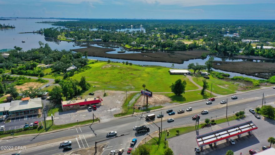 Approx 600' of WATERFRONT with Deep Water Access & 590' of Hwy 77 Road Frontage in the heart of Southports busiest intersection of Hwy 77 and Hwy 2321. This is a Rare Find of C-1 &C-3 and R2 (can be rezoned) The seller is offering the opportunity to buy all or plat. See CSP K in document section. The restaurant is a working restaurant and the Private home has been completely remodeled. The possibilities are endless.  Southport is expanding and growing at a phenomenal rate. This property would make a Great Hotel/Motel site, RV Park with Boat docks, Commercial strip center, Fast Food or any number of combinations you can think of. The owner is will to consider subdividing.  What a great, High Traffic area, with easy ingress. The owner has pulled sewer to the property with lift station that will accommodate growth.