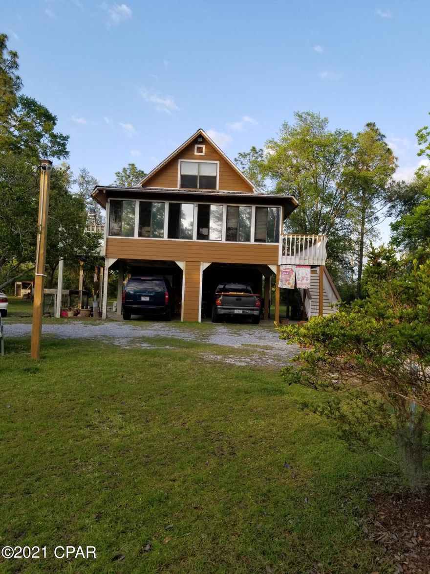 'CURRENTLY UNDER CONTRACT, SELLER ACCEPTING BACKUP OFFERS' This 4 bedroom, 2 and one-half bath house has plenty of room for a family and guests. Enjoy this A-frame home in a security-gated lake subdivision that offers amenities such as swimming pool, men's and women's restrooms at the recreation area, basketball court, tennis court, boat launch, toddler playground and more. This home has newly installed Hardi board siding, metal roof, new AC units, new well pump, and covered parking for two vehicles. Outside acres are landscaped with lots of oak trees and azaleas. The circle driveway leads to the home that sits off the road for more privacy. There is a 16x20 wired shop with an upstairs and metal roof, and another building for lawn mower, tools and large well tank.