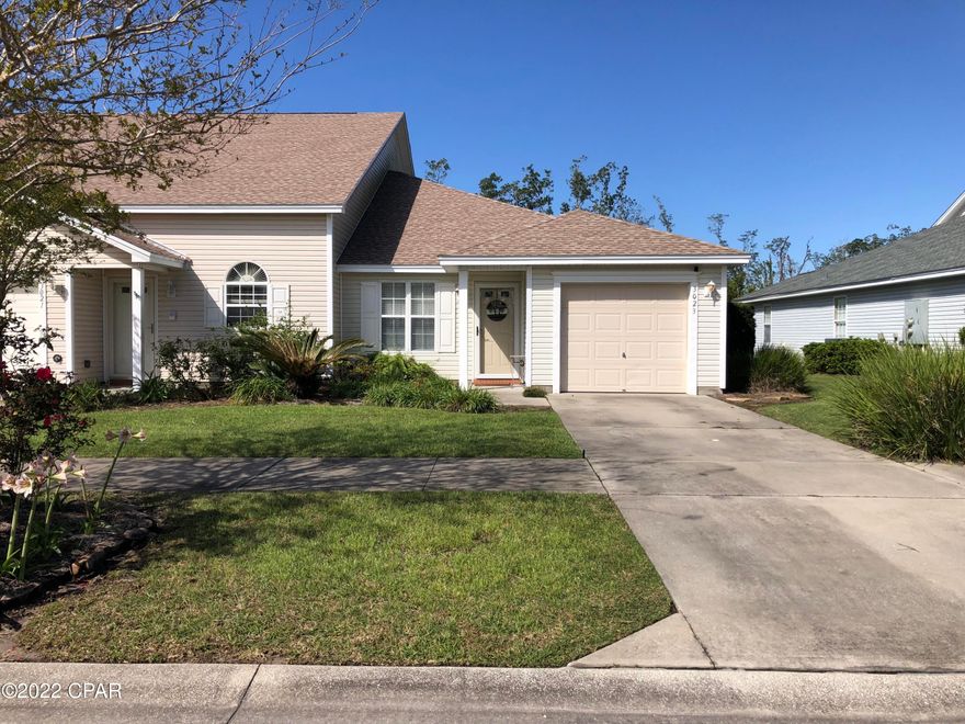 CURRENTLY UNDER CONTRACT, SELLER ACCEPTING BACKUP OFFERS. Beautifully landscaped 2 bed, 2 bath end unit located in the desirable Hammocks neighborhood in Lynn Haven. Enjoy easy living with no yard work required, and the association pressure washes the home and driveway. This neighborhood is well groomed and tastefully landscaped and includes sidewalks throughout the community. Relax in the large community pool! You'll love the convenient location close to schools, shopping, medical, and entertainment. Seller will offer home warranty with full price offer. Call today!